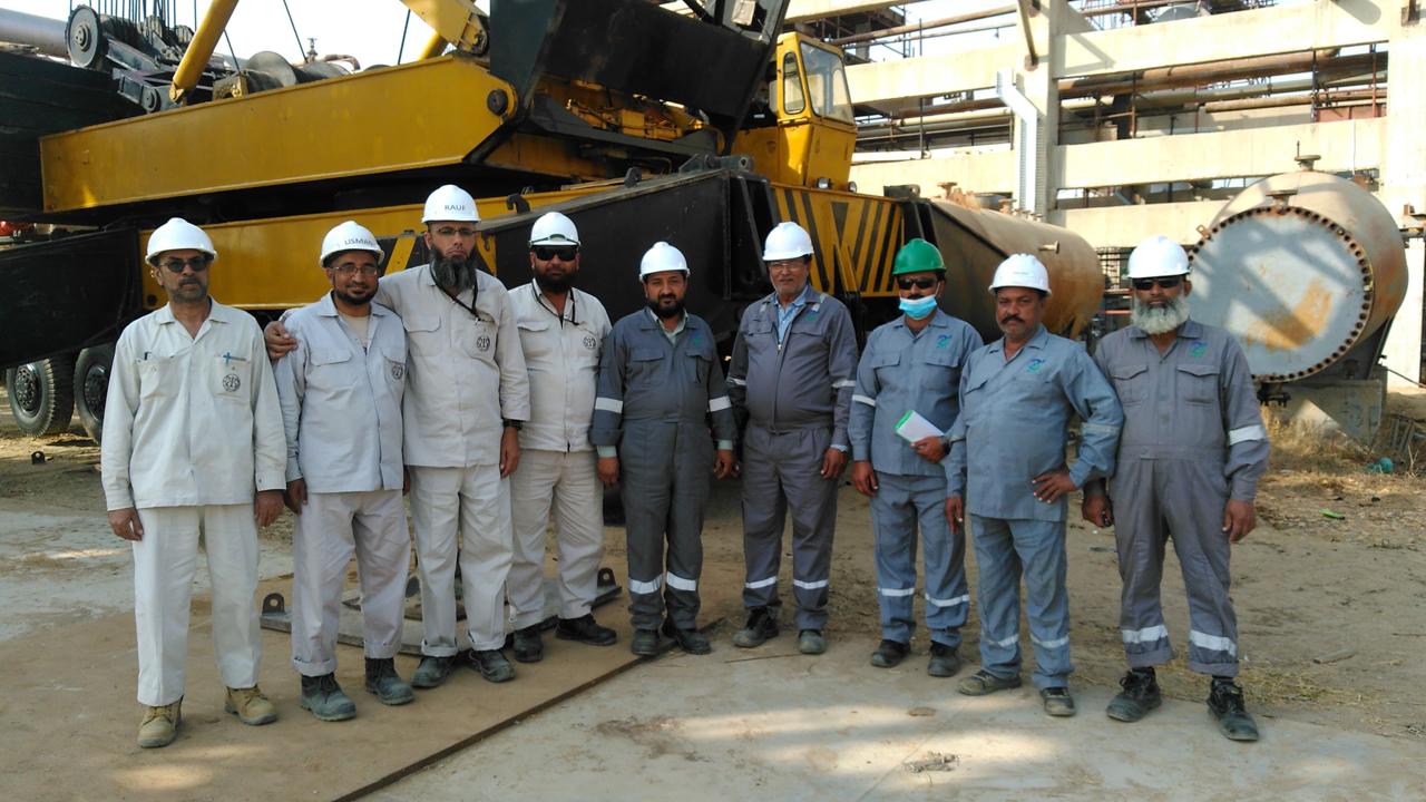 MEEC engineers reviewing drawings on a steel fabrication workshop floor
